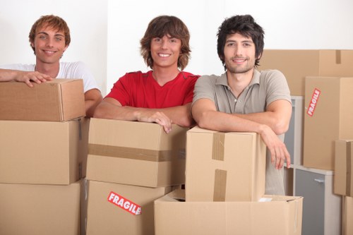 Professional movers loading furniture for a St Pancras move