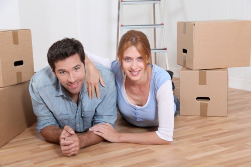 Professional movers handling furniture during house removals in Stpancras